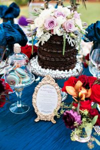 chocolate ganache grooms cake naked silver pedestal topped with fresh flowers
