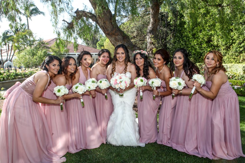 Bride and Bridesmaids in pretty pink long dress