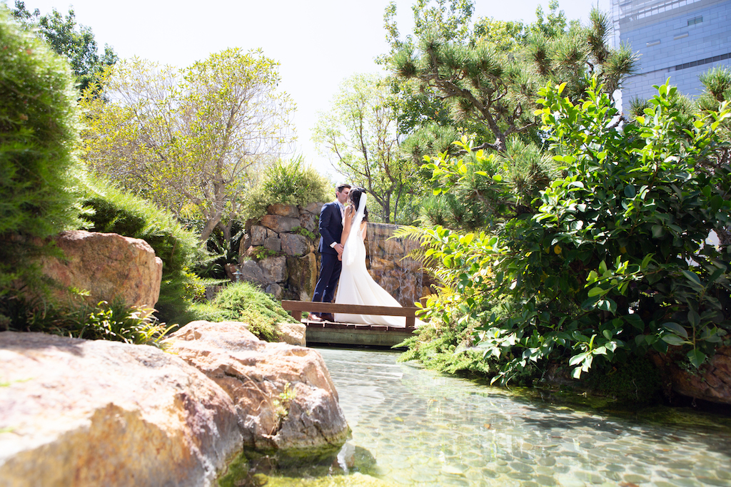 Debra and Claude's first look by the waterfall at DoubleTree DTLA's Kyoto Garden.

Edwin So Photography