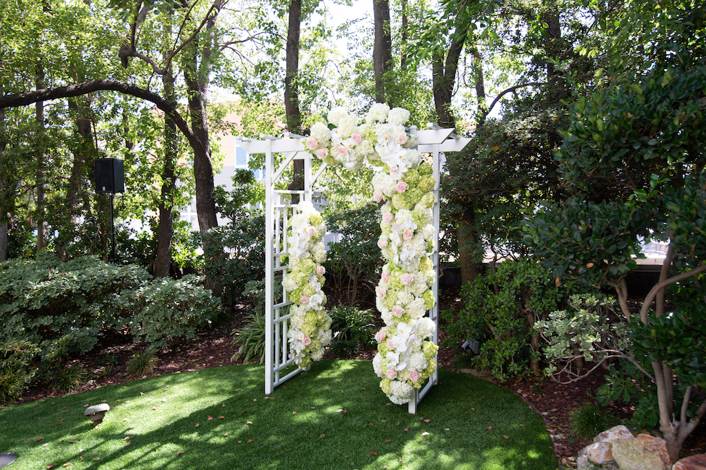 Wedding ceremony arch full of lush hydrangeas by Kika's Designs.

Edwin So Photography