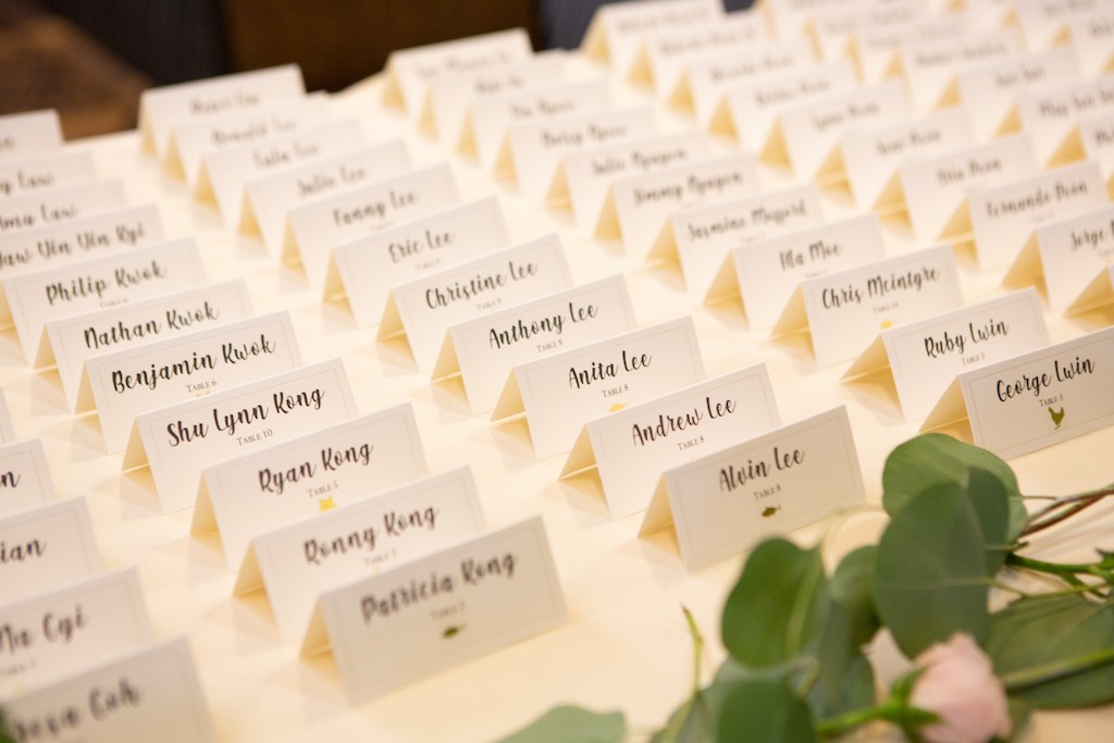Escort cards placed in front of the reception area, ready for guests to find their seats.

Edwin So Photography