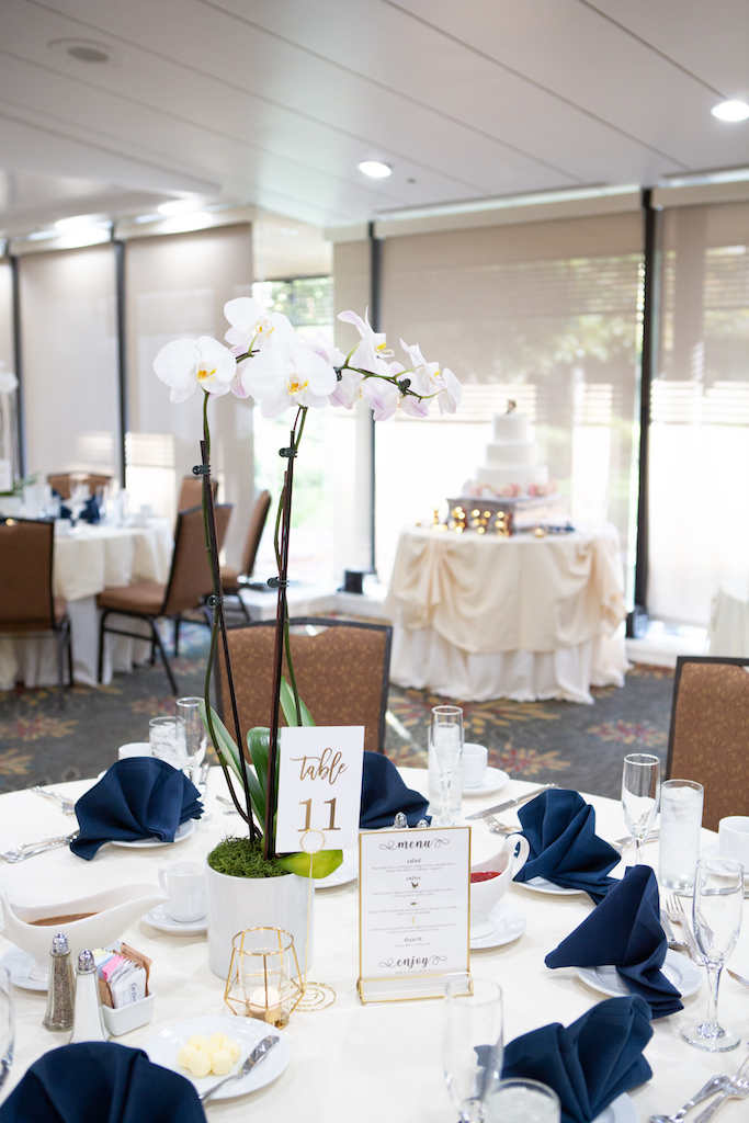 Classic orchid reception centerpieces in the Thousand Cranes Ballroom.

Edwin So Photography