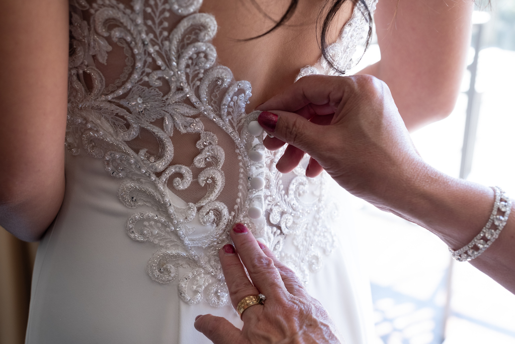 Look at the beautiful details on Debra's wedding dress as she was getting ready.

Edwin So Photography