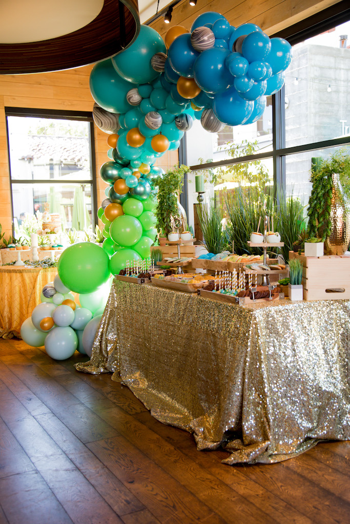 A beautiful dessert table set up by Lavish Candy Sweetology, with a balloon garland from Stars Above Balloons.

Trista Maja Photography