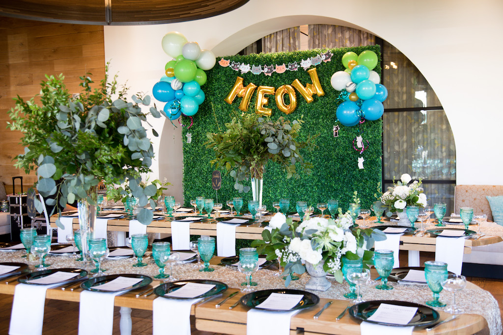 The reception set up was bright and colorful, with a large hedge wall set up for photos!

Trista Maja Photography