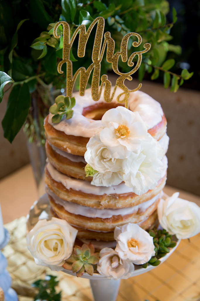 The couple didn't want to do a traditional cake, and decided to do a large donut cake instead!

Trista Maja Photography