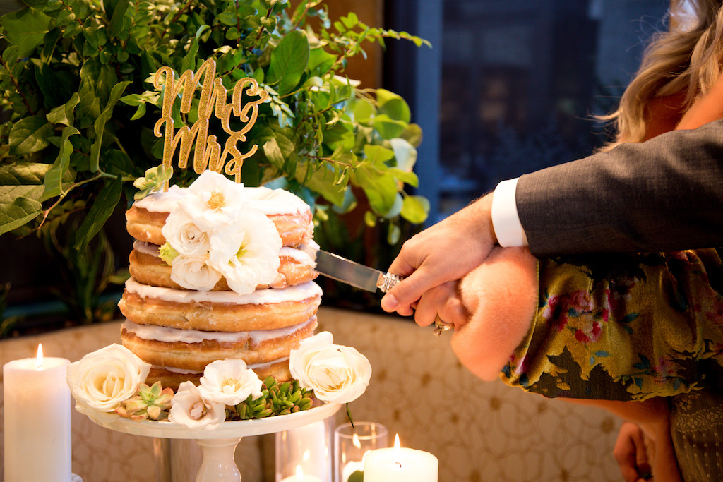 Yum! Layers of donuts stacked for the perfect donut-loving couple.

Trista Maja Photography