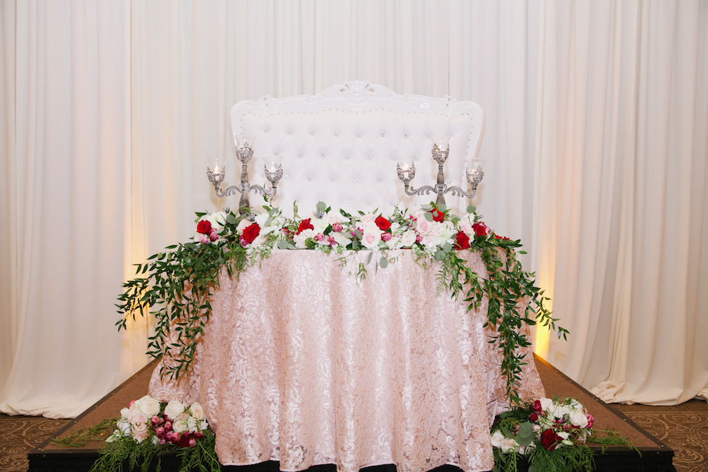 A beautiful sweetheart table with a "throne" for the couple.

Photo by GC Masterpiece