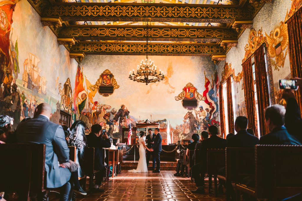 A romantic ceremony in the Mural Room of the Santa Barbara Courthouse.