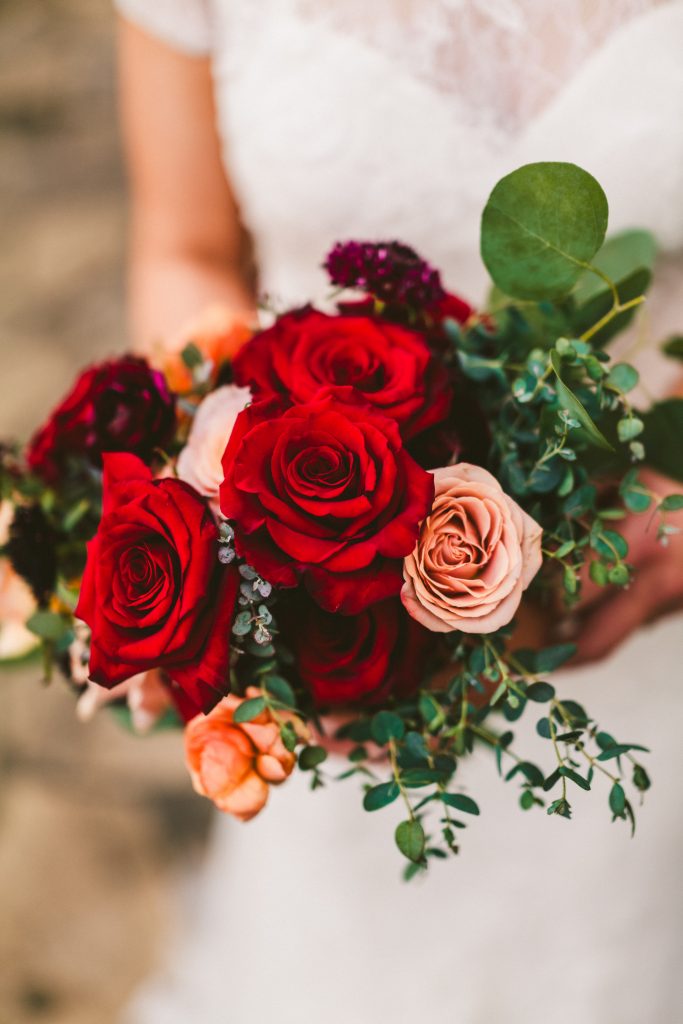 A gorgeous bouquet of deep red roses was perfect for this winter wedding.