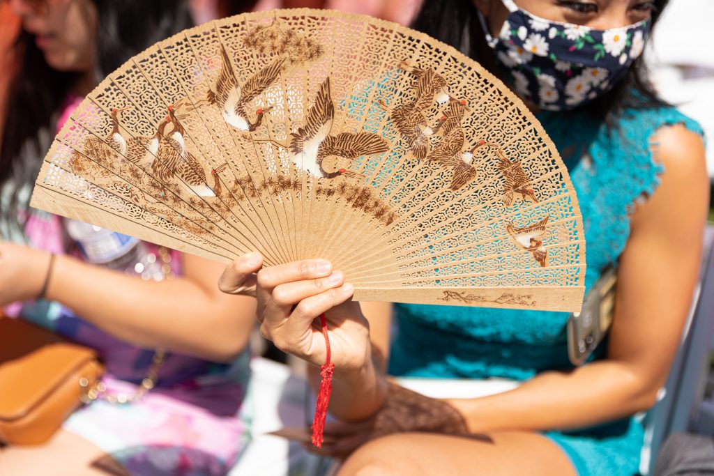 wooden fan painted with cranes